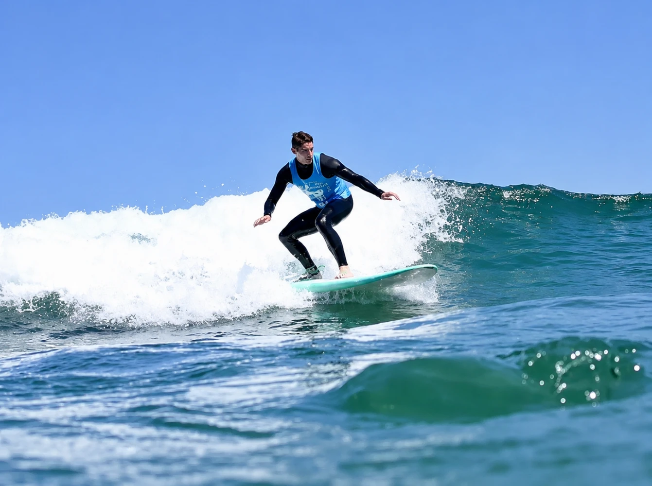 A surfer riding a wave during a lesson near Lagos