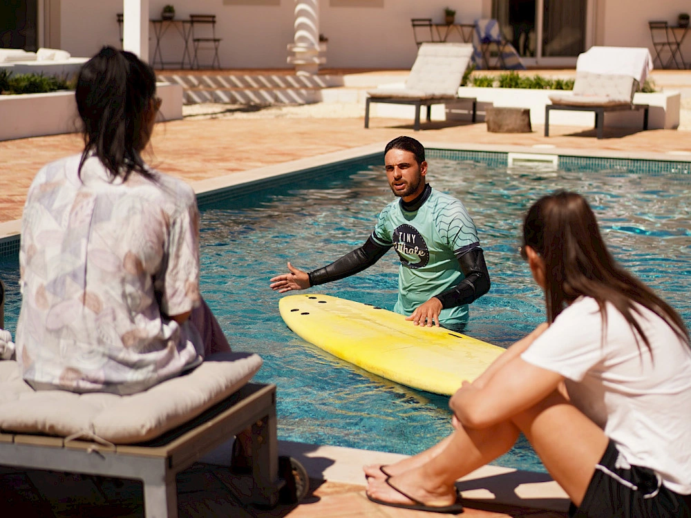 a man and woman sitting in a pool