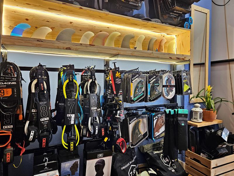 a close up of a rack of surf gear and equipment