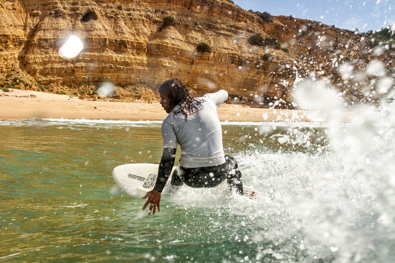 an advanced surfer riding the waves in Lagos